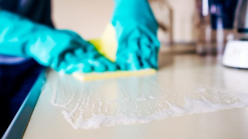 A clean mattress protected with fresh bedding